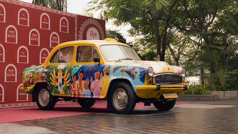 A reimagined yellow taxi in Kolkata, painted with motifs from the 1980s, brings nostalgia to the streets this Pujo - Supplied