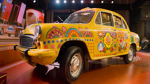 Kolkata’s yellow taxis, once a fading symbol, return this Pujo as vibrant moving artworks celebrating four decades of festival creativity