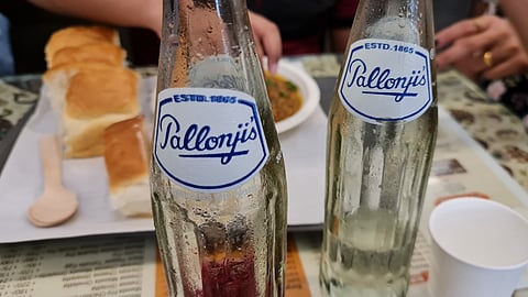 A neon-pink fizzy drink with cult status, Pallonji’s Raspberry Soda traces its roots to Irani cafés in Mumbai, symbolising nostalgia and community.