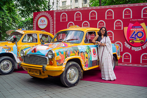 Artist Meenakshi Sengupta’s design evokes the Pujo of the late 1990s, with chandannagar lights and bustling pandal scenes