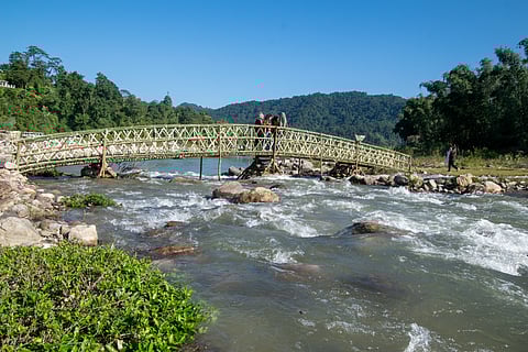 People of Basar celebrating the annual festival (Bas Con) by engaging in multiple traditional activites and rituals on a riverside place near to a village