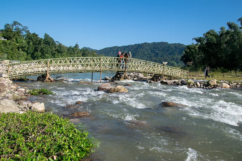 People of Basar celebrating the annual festival (Bas Con) by engaging in multiple traditional activites and rituals on a riverside place near to a village