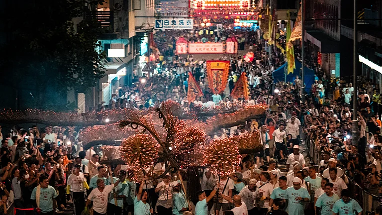 People participating in the Tai Hang Fire Dragon Dance, Hong Kong - Lampson Yip/Clicks Images | Hong Kong Tourism Board