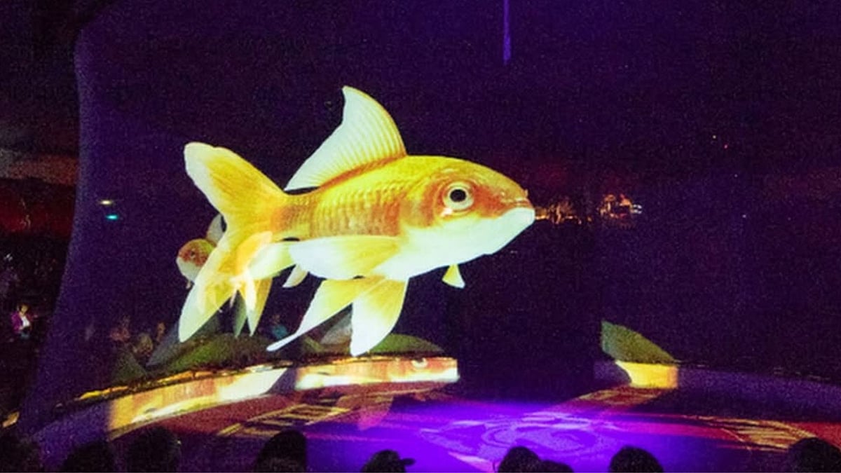 Holographic elephants, horses, and even fish perform acrobatics and interact with human performers, preserving the magic of the circus without harming animals