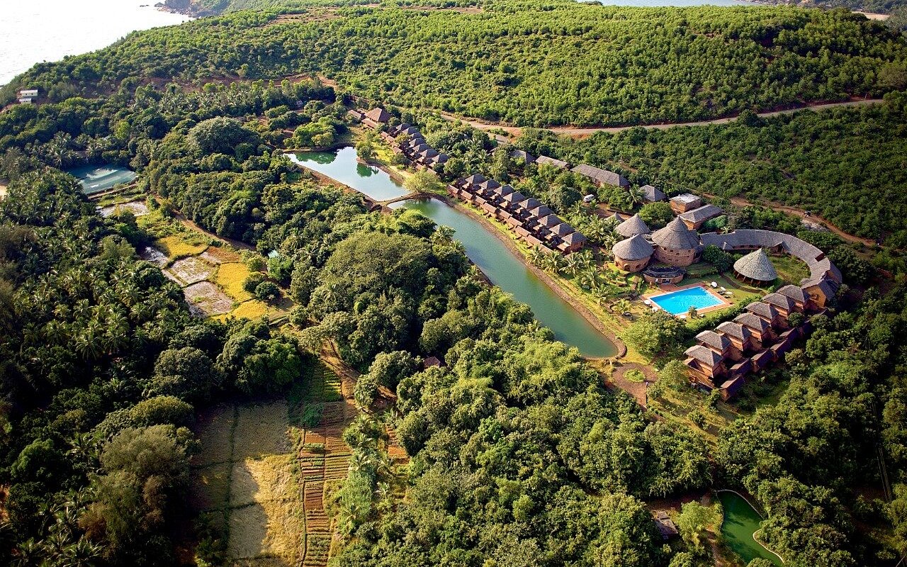 Set above Om Beach in Gokarna, SwaSwara blends Ayurveda, yoga, and organic living with pet-friendly policies for a mindful coastal escape.