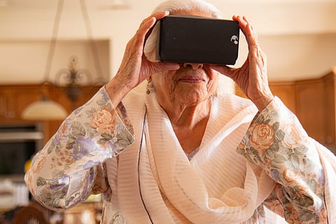 An elderly woman experiencing VR through Project Dastaan