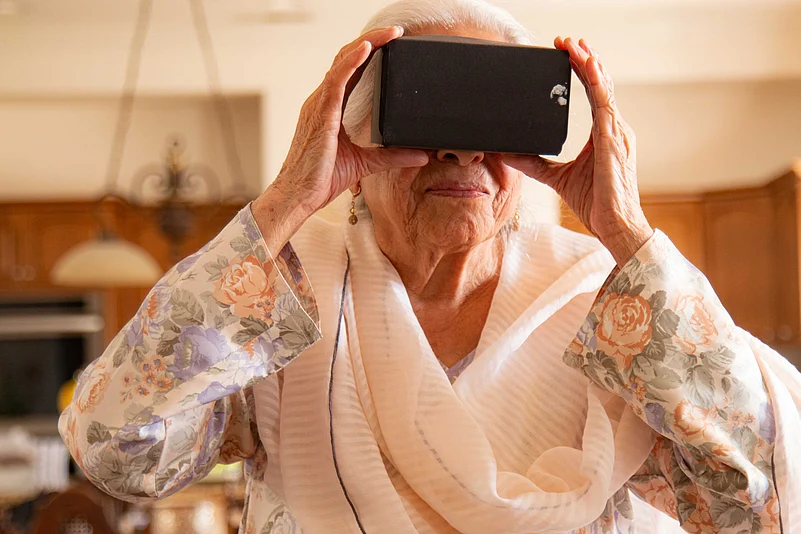 An elderly woman experiencing VR through Project Dastaan