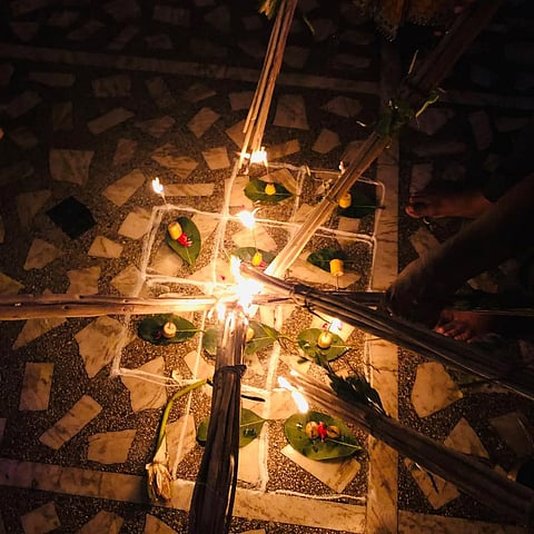 The flickering flames of the jute sticks symbolise a guiding light