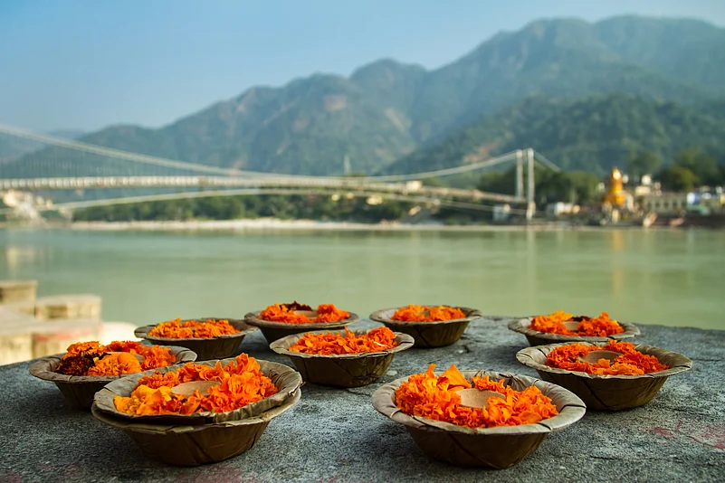 Puja flowers to the Ganges in Rishikesh, symbolising prayer and devotion