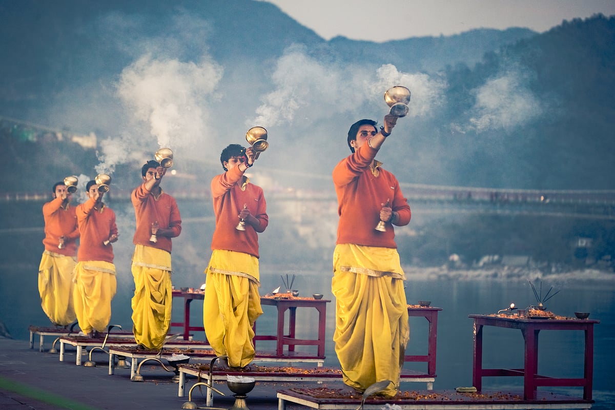 Priests perform the sacred Ganga Aarti along the ghats of the river Ganga