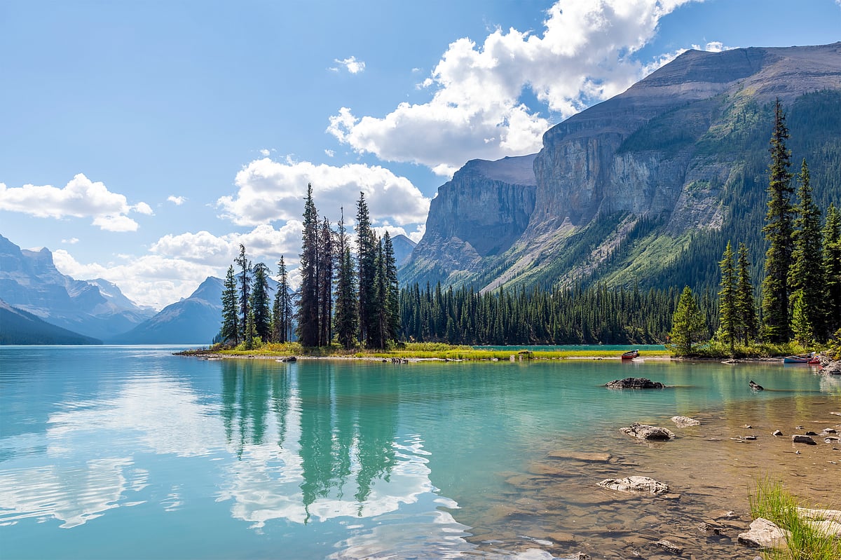 Spirit Island reflecting in the calm summer waters of Jasper National Park
