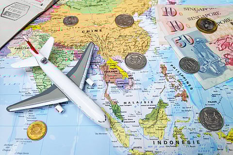 World map with Singapore currency