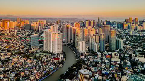 The Rockwell Center skyline glows over Makati, Metro Manila