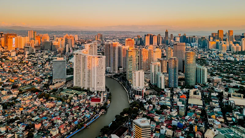 The Rockwell Center skyline glows over Makati, Metro Manila