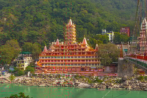View of Lakshman Jhula and Tera Manzil Temple along the Ganga in Rishikesh