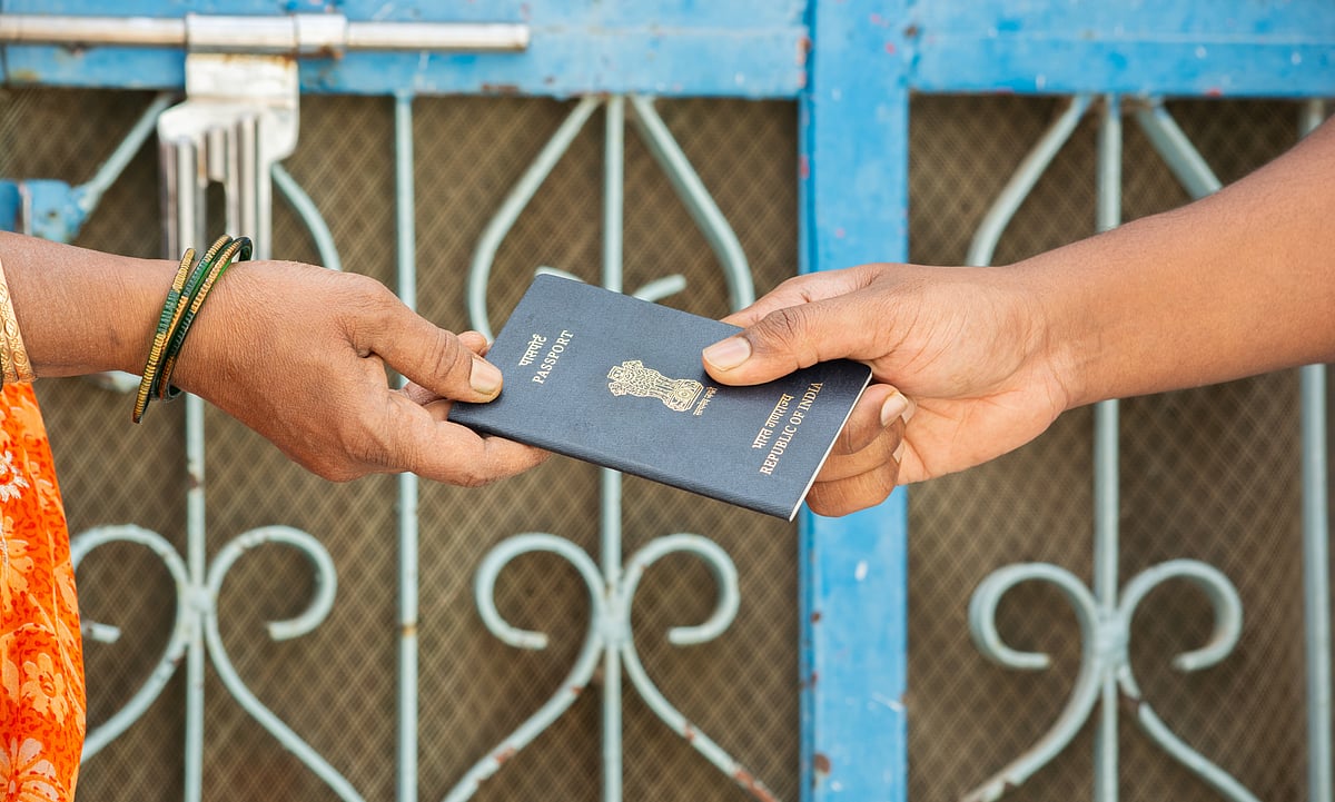 Woman receives her passport at home in India