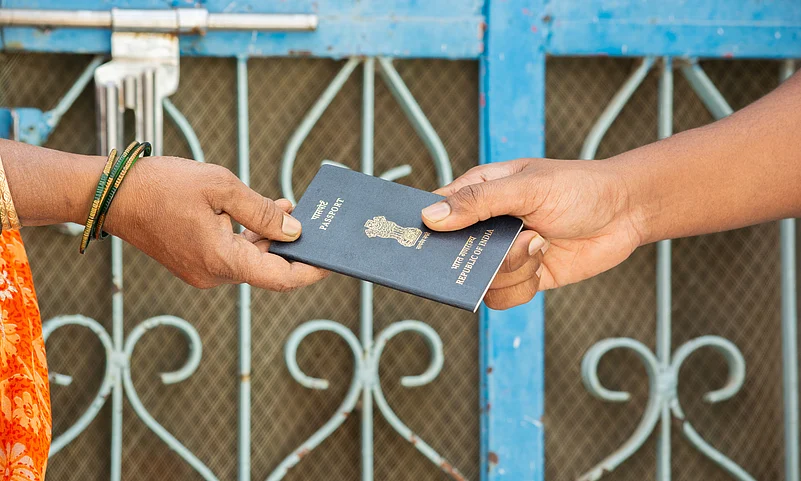 Woman receives her passport at home in India