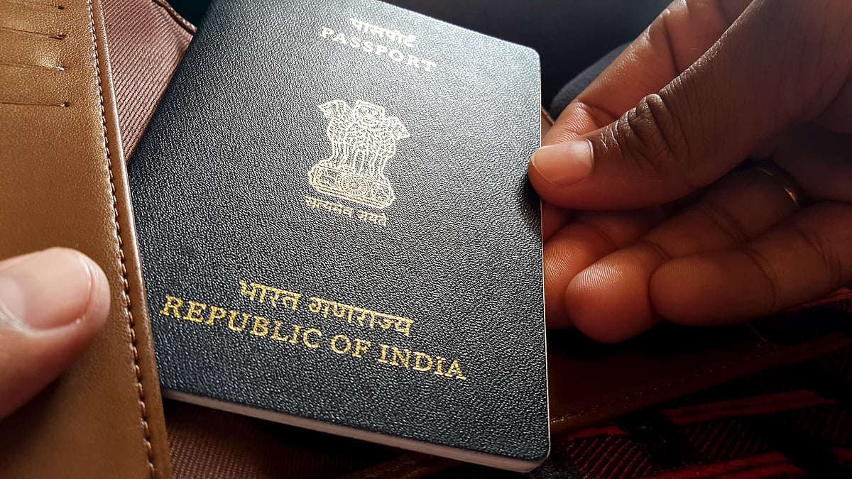 An Indian passport being taken out of a wallet