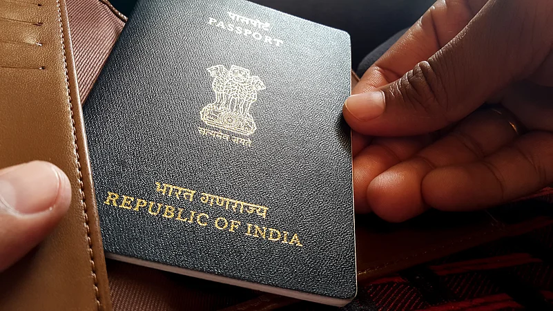 An Indian passport being taken out of a wallet