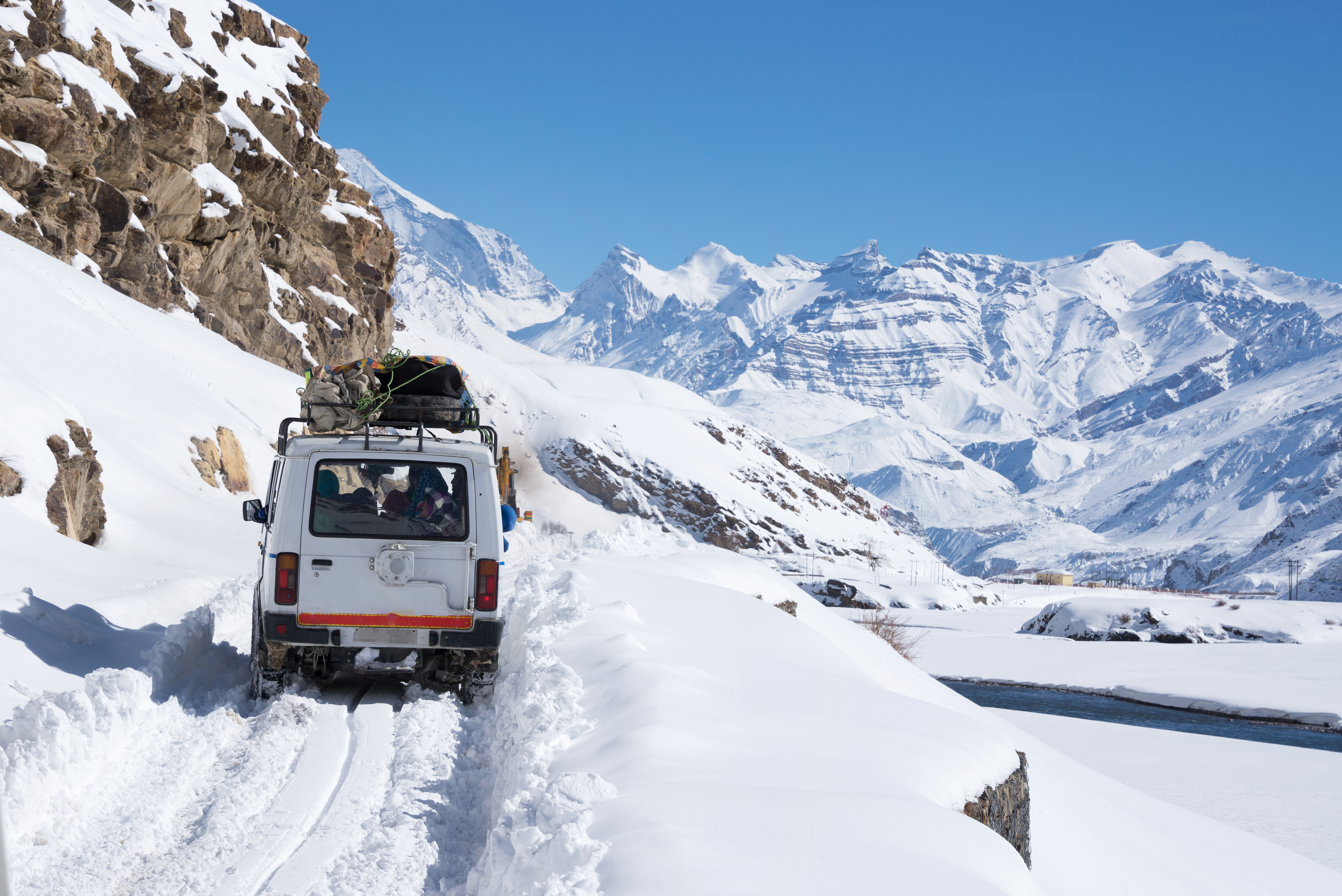 Driving through the snow-laden mountain roads of Spiti Valley in winter