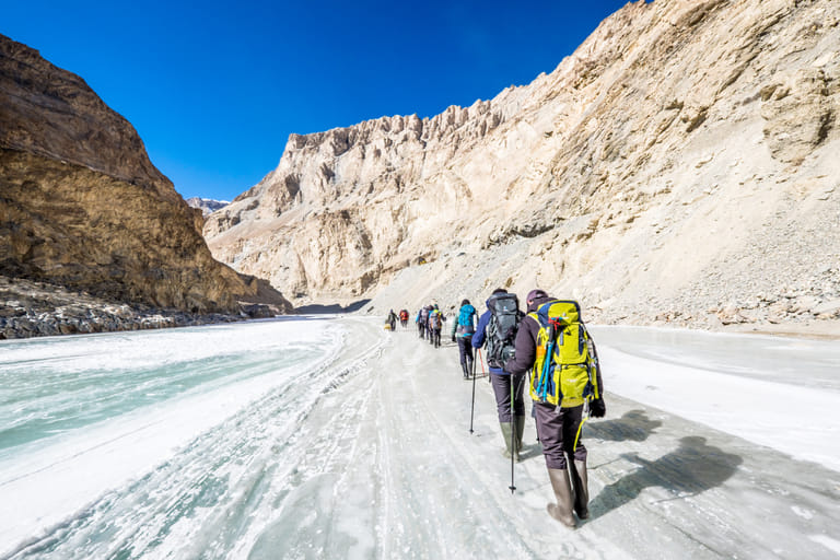 Trekking across the frozen Zanskar River during winter - Shutterstock