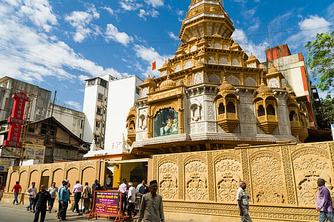 A beloved Ganesha temple featuring a gold-adorned idol, central to Pune’s Ganesh Chaturthi and community service traditions.