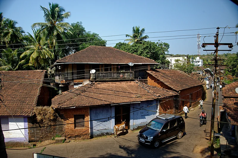 The houses are typical in the Konkan region, which often features roofs with terracotta tiles