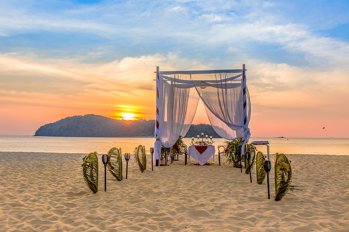 A romantic beachside setup, perfect for a wedding or sunset dinner