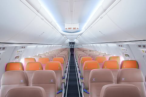 The refreshed cabin features ergonomically designed leatherette seats, mood lighting, and in-seat USB-C charging for a more comfortable flying experience.