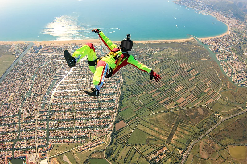 A skydiver soars over Dubai, capturing the thrill of adventure