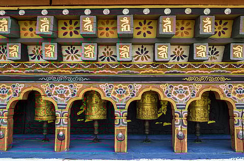 Prayer wheels at Chimi Lhakhang Monastery, one of Punakha’s most revered Buddhist sites