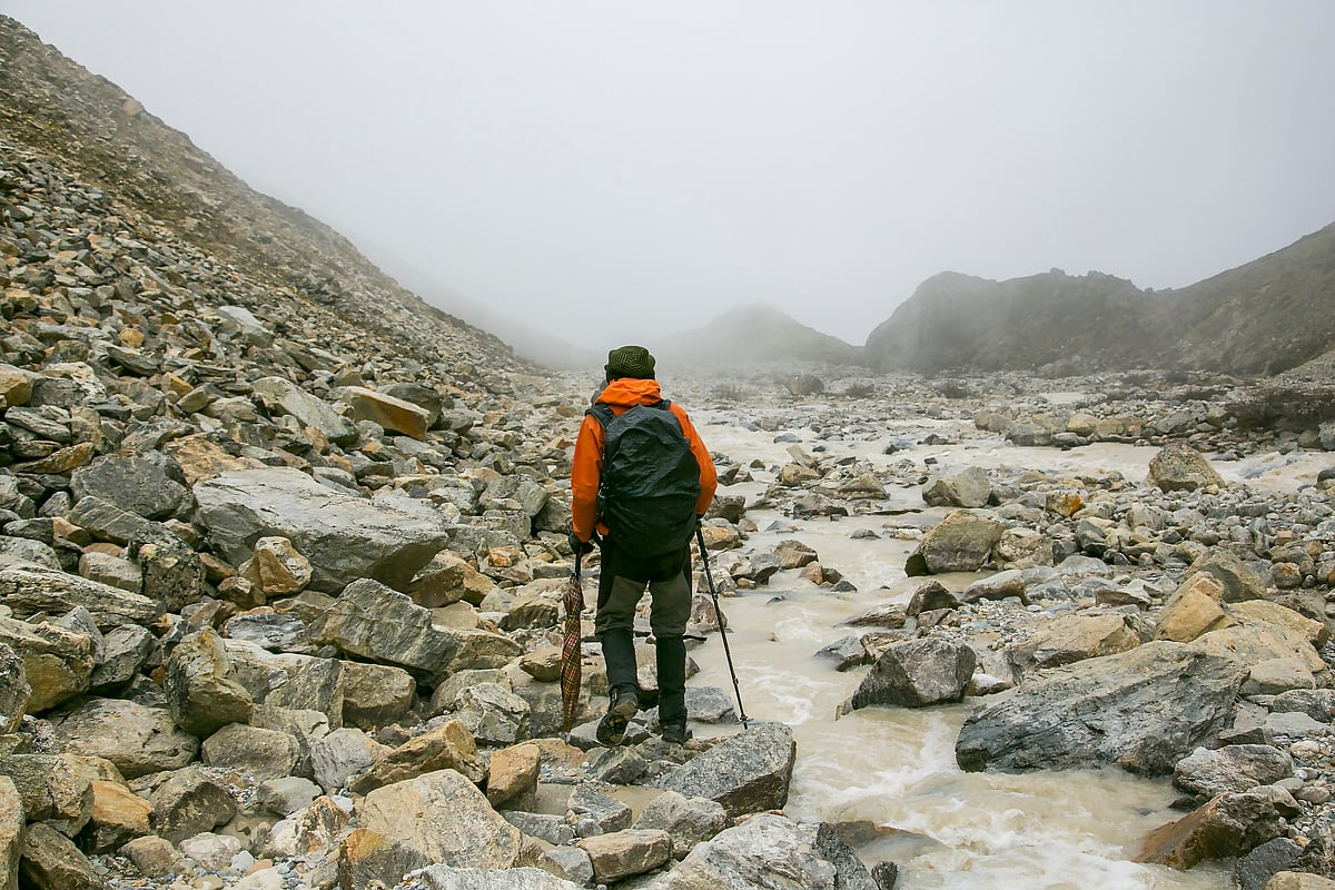 A hiking guide leads the way along the Snowman Trek of Bhutan