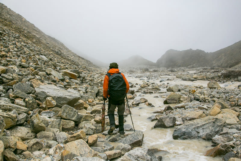 A hiking guide leads the way along the Snowman Trek of Bhutan