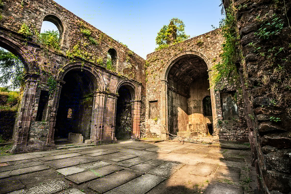 Lush greenery surrounds the historic Vasai Fort after the monsoon