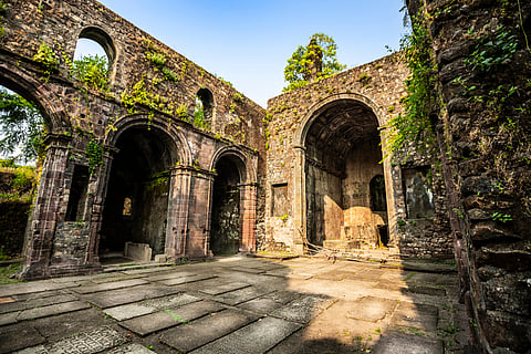 Lush greenery surrounds the historic Vasai Fort after the monsoon