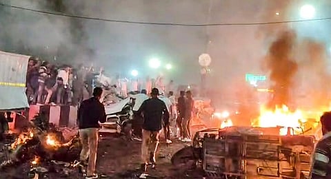 Delhi Police and bomb squad officers cordon off the Red Fort vicinity as investigations continue following the explosion