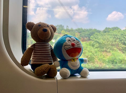 The rise in plushie travel is linked to both personal comfort practices and cultural fandom movements such as Japan’s oshi katsu.