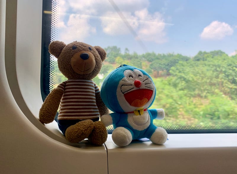 The rise in plushie travel is linked to both personal comfort practices and cultural fandom movements such as Japan’s oshi katsu.