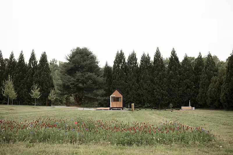 Small yet serene, this forest hideaway pairs Scandinavian design with a wood-fired sauna and backcountry calm.