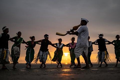 Tarpa dancers formed a circle around the Tarpa player, as the sun dipped over the Gholvad Beach