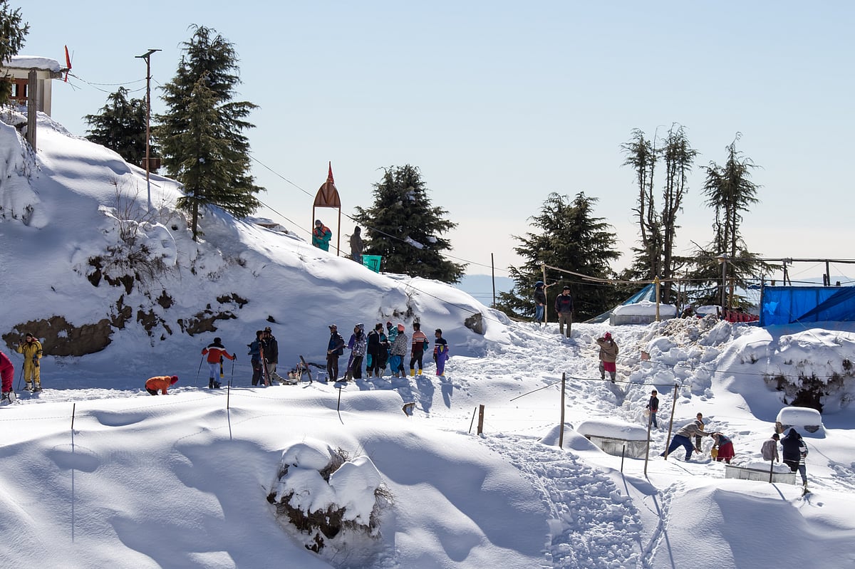 Visitors enjoy winter fun on Kufri’s snow-covered slopes above Shimla