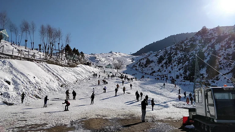 Auli’s sunlit winter slopes open to sweeping Himalayan views - Shutterstock