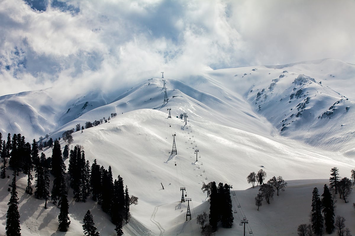 Snow-draped Gulmarg glows under the winter sun