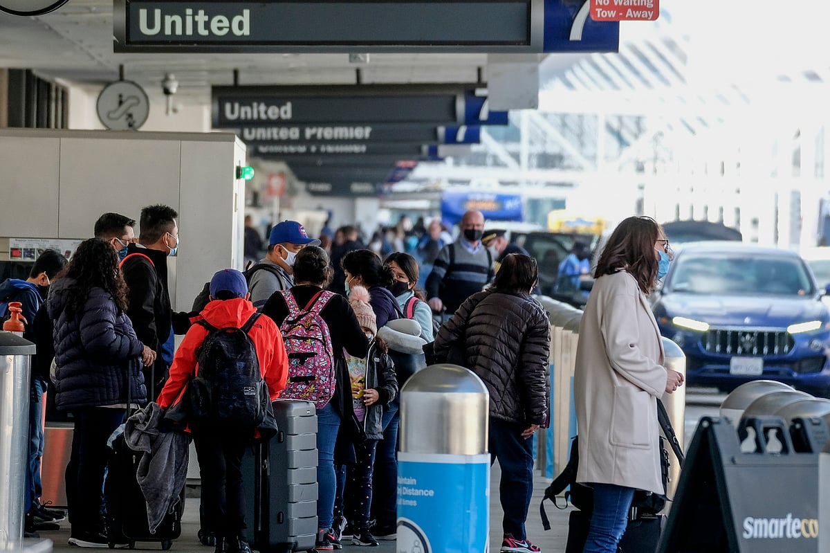 Holiday travellers arrive at Los Angeles International Airport during the busy Thanksgiving rush