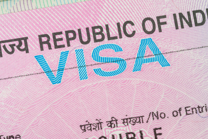 An India visa stamped inside a passport