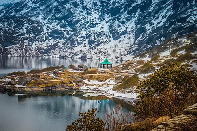 Shutterstock : Tsongmo Lake, Sikkim, a serene glacial lake framed by rugged Himalayan slopes