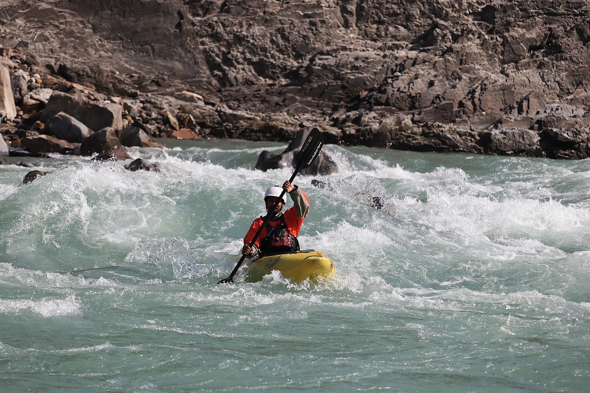A rafter paddles through Ganga’s rapids in Rishikesh