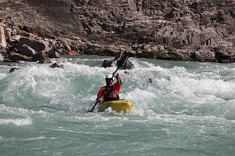 A rafter paddles through Ganga’s rapids in Rishikesh