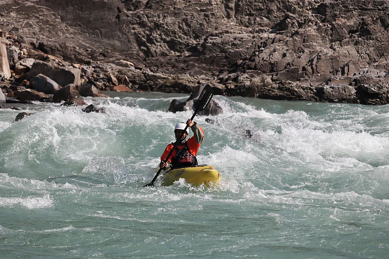 A rafter paddles through Ganga’s rapids in Rishikesh