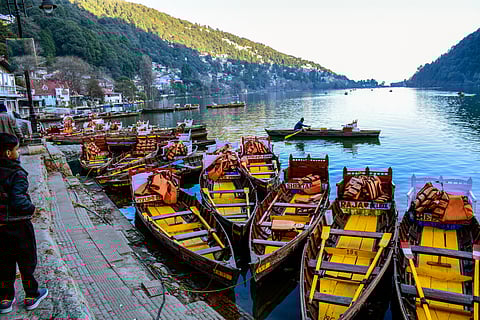 Colourful boats line the calm waters of Nainital Lake